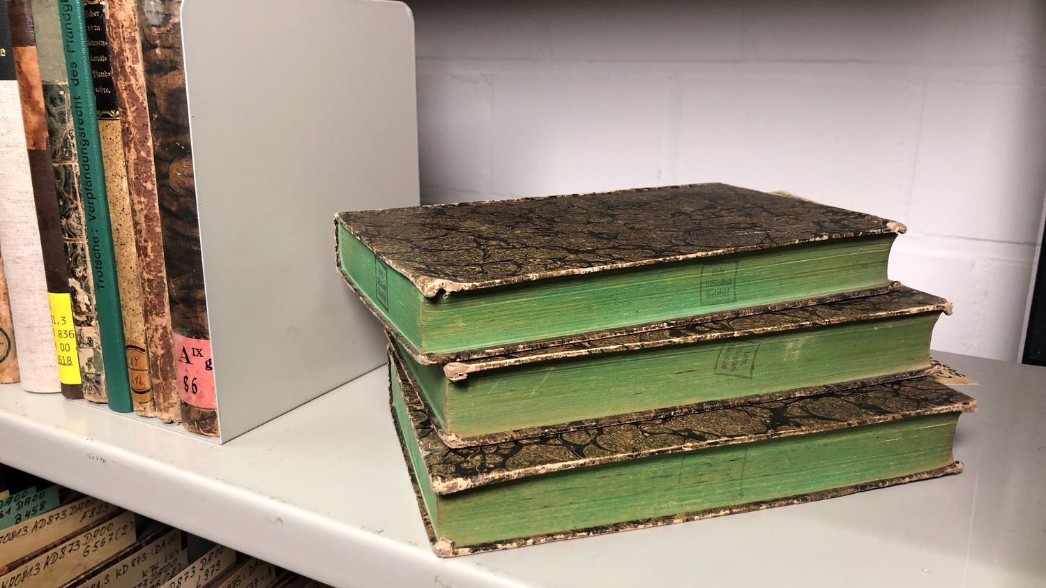 REPORTING.  'May cause discomfort, vomiting or diarrhoea': 19th-century books stained with arsenic removed from German libraries